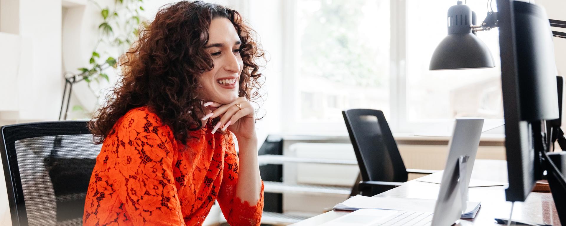 Woman Using Computer For Financial Webinars