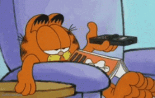 Garfield the cat pressing pause on a remote