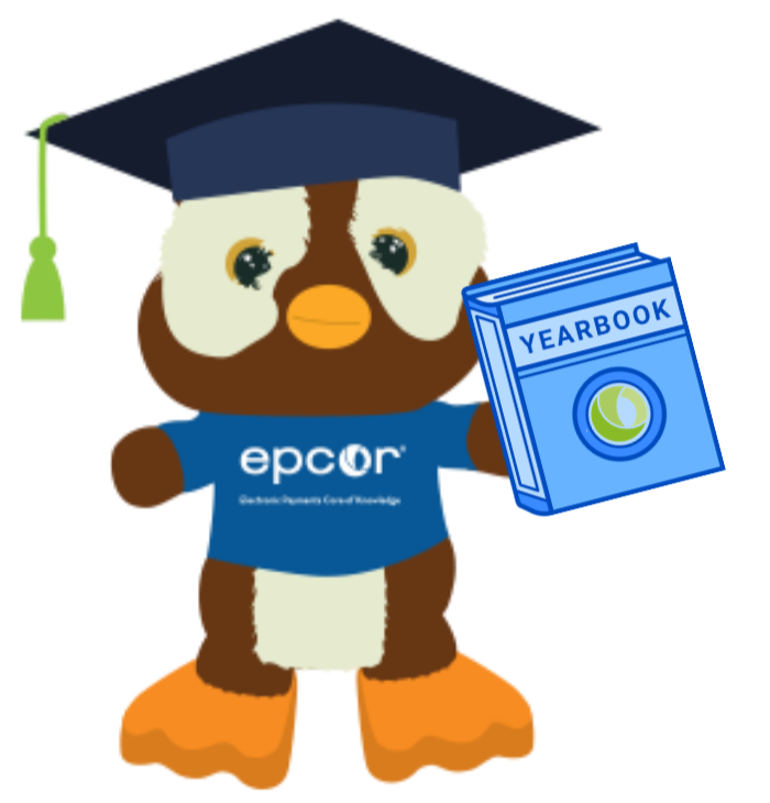 image: Hoot-E holding a yearbook