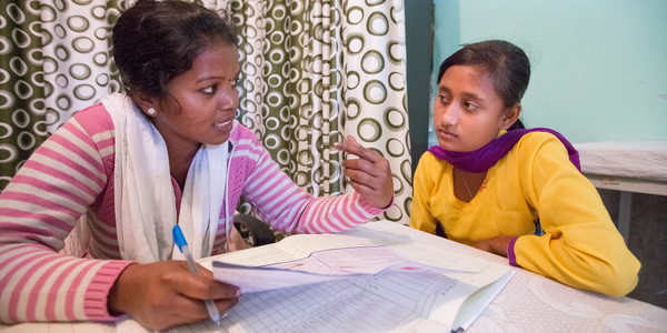Healthworker in India speaks with a teenager about her reproductive health and rights.