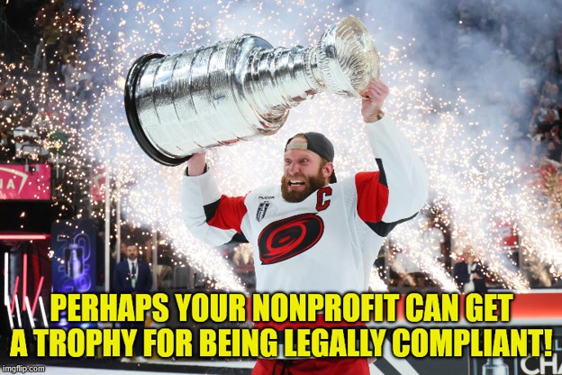 Photo of NHL Hurricanes hockey play Jordan Staal raising the Stanley Cup overhead and celebrating the Hurricanes win over the Vegas Golden Knights in the final game of the series to win the 2026 Stanley Cup Championship.