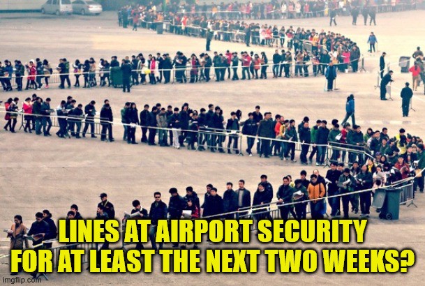 A miles-long line of people standing in a line that serpentines across a dirt field. Text reads 'Lines at airport security for at least the next two weeks?'