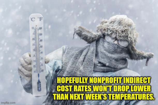 A person completely bundled up in layers of winter clothes, coat, scarf, hat and goggles stands in heavily falling snow while holding a thermometer. Text reads 'Hopefully nonprofit indirect cost rates won't drop lower than next week's temperatures.'